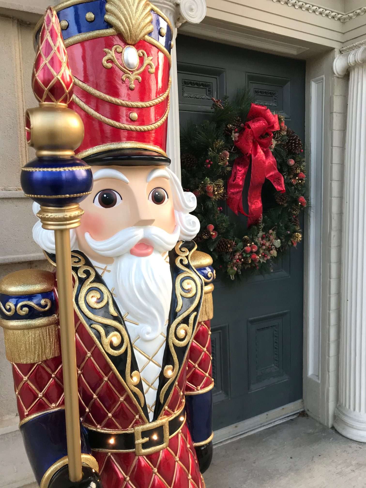 A large nutcracker decoration stands outside the front door of the Haan Museum